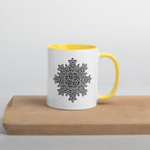 A Xigfireon white ceramic 11oz mug featuring the Black & White Solid iteration of the `Morning Star Fire` Celtic knot design, with yellow handle and inside. This Celtic knot symbolizes Father Sun.