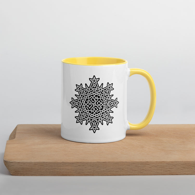 A Xigfireon white ceramic 11oz mug featuring the Black & White Solid iteration of the `Morning Star Fire` Celtic knot design, with yellow handle and inside. This Celtic knot symbolizes Father Sun.