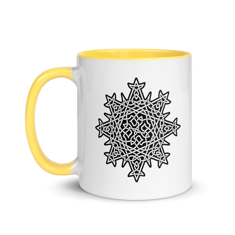 A Xigfireon white ceramic 11oz mug featuring the Black & White Solid iteration of the `Morning Star Fire` Celtic knot design, with yellow handle and inside. This Celtic knot symbolizes Father Sun.