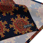 A close up view of the Xigfireon logo on a large sized (25.25 inch x 25.25 inch) `Morning Star Fire` Fire Colour Cosmos bandana.