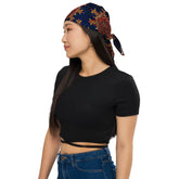 A young woman wearing a Xigfireon bandana adorned with the `Morning Star Fire` Fire Colour Cosmos Celtic knot pattern.