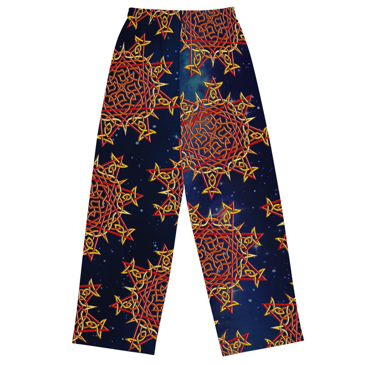 The back side of a pair of Xigfireon graphic wide leg pants featuring the Fire Colour Cosmos patterned series of the `Morning Star Fire` Celtic knot design.