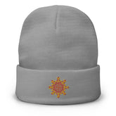 A grey Xigfireon knit beanie embroidered with the Fire Colour iteration of the `Morning Star Fire` Celtic knot design.