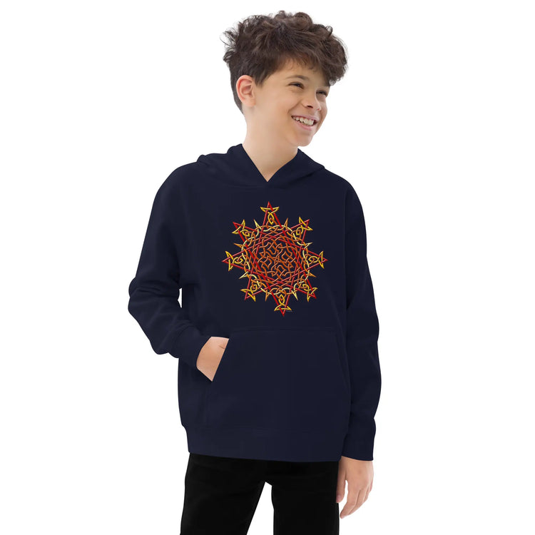 A young boy wearing a kids navy blue graphic hoodie featuring the Fire Colour iteration of the `Morning Star Fire` Celtic knot design.