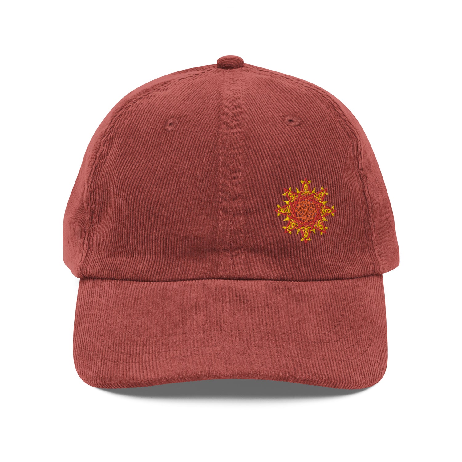 The front side of a burgundy Xigfireon vintage corduroy cap embroidered with the Fire Colour iteration of the `Morning Star Fire` Celtic knot design offset to the left.
