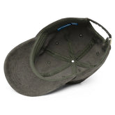 A view of the inside of an olive green Xigfireon vintage corduroy cap.