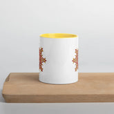 The front side of a Xigfireon white ceramic 11oz mug featuring the Fire Colour iteration of the `Morning Star Fire` Celtic knot design, with yellow handle and inside. This Celtic knot symbolizes Father Sun.