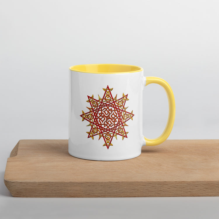 A cutting board displaying a Xigfireon white ceramic 11oz mug featuring the Fire Colour iteration of the `Morning Star Fire` Celtic knot design, with yellow handle and inside. This Celtic knot symbolizes Father Sun.