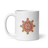 A Xigfireon white ceramic 11oz mug featuring the Fire Colour iteration of the `Morning Star Fire` Celtic knot design. This Celtic knot symbolizes Father Sun.