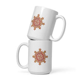 A stack of two Xigfireon white ceramic 15oz mugs featuring the Fire Colour iteration of the `Morning Star Fire` Celtic knot design. This Celtic knot symbolizes Father Sun.