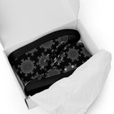 A shoebox containing a pair of Xigfireon black soled canvas high tops featuring the Greyscale iteration of the `Morning Star Fire` Celtic knot pattern.