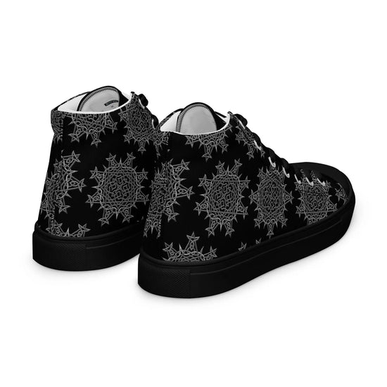 A view of the back of a pair of Xigfireon black soled canvas high tops featuring the Greyscale iteration of the `Morning Star Fire` Celtic knot pattern.