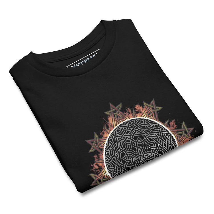 A black folded Xigfireon kids graphic t-shirt featuring the Eclipsed iteration of the `Morning Star Fire` Celtic knot design. The `Morning Star Fire` Celtic knot represents the sun.