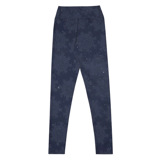 The back side of a pair of Xigfireon graphic yoga leggings featuring the Midnight Blue Cosmos patterned series of the `Morning Star Fire` Celtic knot design.