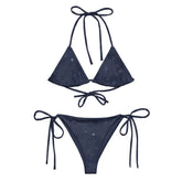 A view of the outside of a string bikini featuring the Midnight Blue Cosmos iteration of the `Morning Star Fire` Celtic knot pattern.