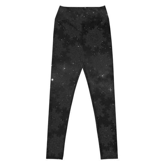 The front side of a pair of Xigfireon graphic yoga leggings featuring the Midnight Cosmos patterned series of the `Morning Star Fire` Celtic knot design.