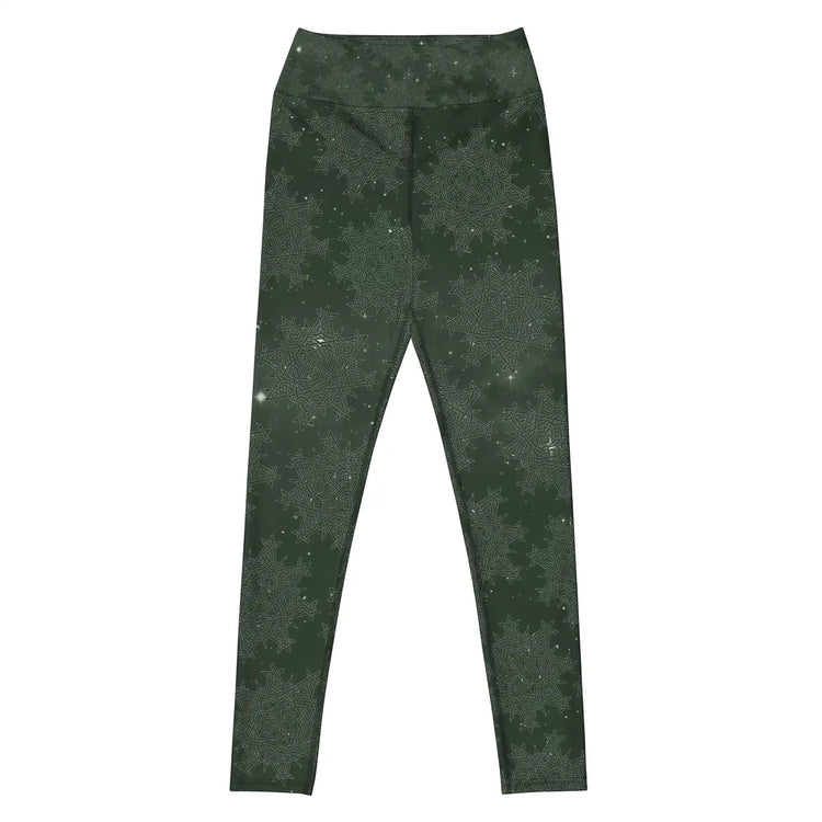 The front side of a pair of Xigfireon graphic yoga leggings featuring the Midnight Green Cosmos patterned series of the `Morning Star Fire` Celtic knot design.