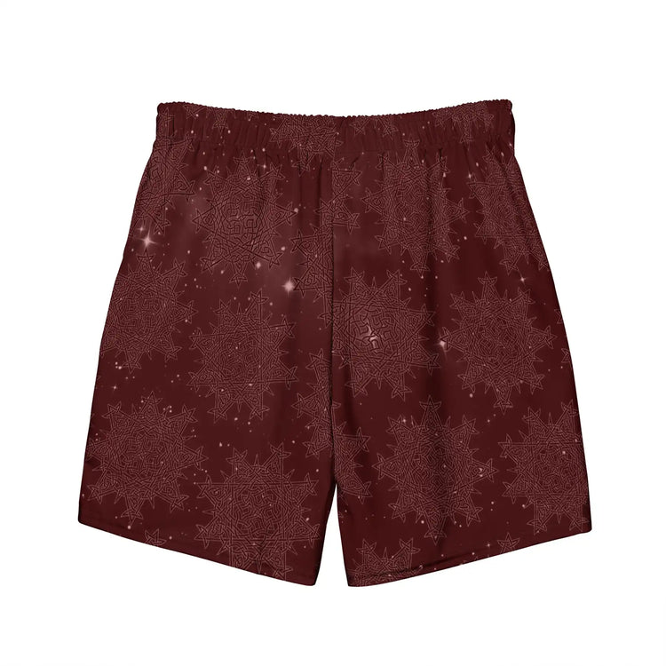 The back side of a pair of Xigfireon graphic swim trunks featuring the Midnight Red Cosmos patterned series of the `Morning Star Fire` Celtic knot design.
