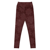 The front side of a pair of Xigfireon graphic yoga leggings featuring the Midnight Red Cosmos patterned series of the `Morning Star Fire` Celtic knot design.