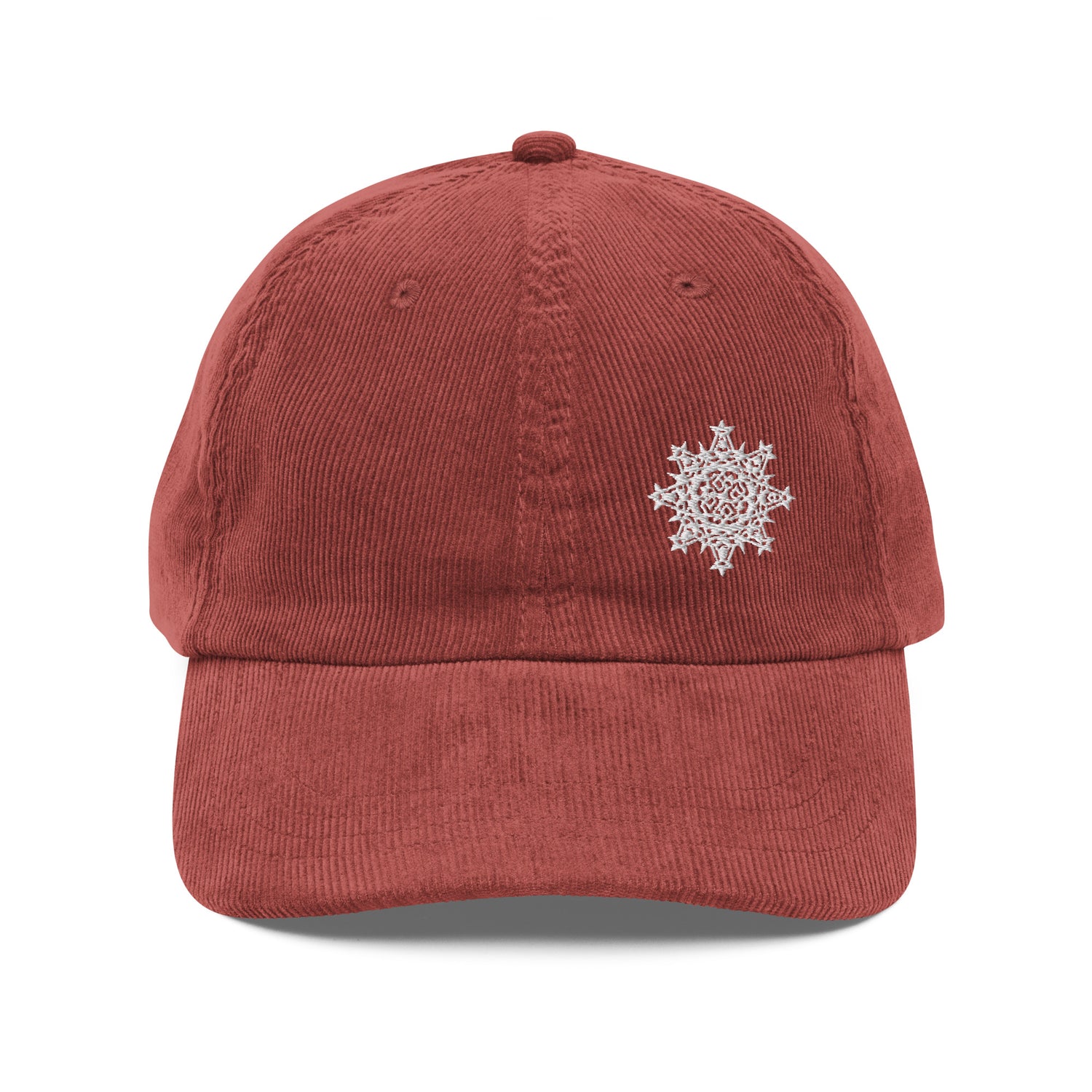 The front side of a burgundy Xigfireon vintage corduroy cap embroidered with the White iteration of the `Morning Star Fire` Celtic knot design offset to the left.