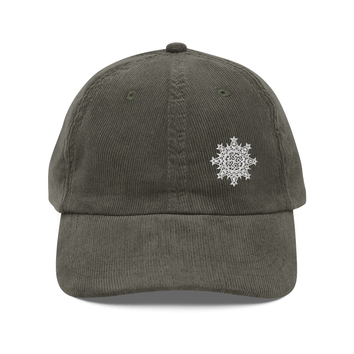 The front side of an olive green Xigfireon vintage corduroy cap embroidered with the White iteration of the `Morning Star Fire` Celtic knot design offset to the left.