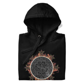 A folded black Xigfireon graphic hoodie featuring the Eclipsed iteration of the `Morning Star Fire` Celtic knot design, inspired by the 2023 Annular Solar Eclipse.