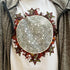 A white Xigfireon graphic t-shirt featuring the Eclipsed iteration of the `Morning Star Fire` Celtic knot design.