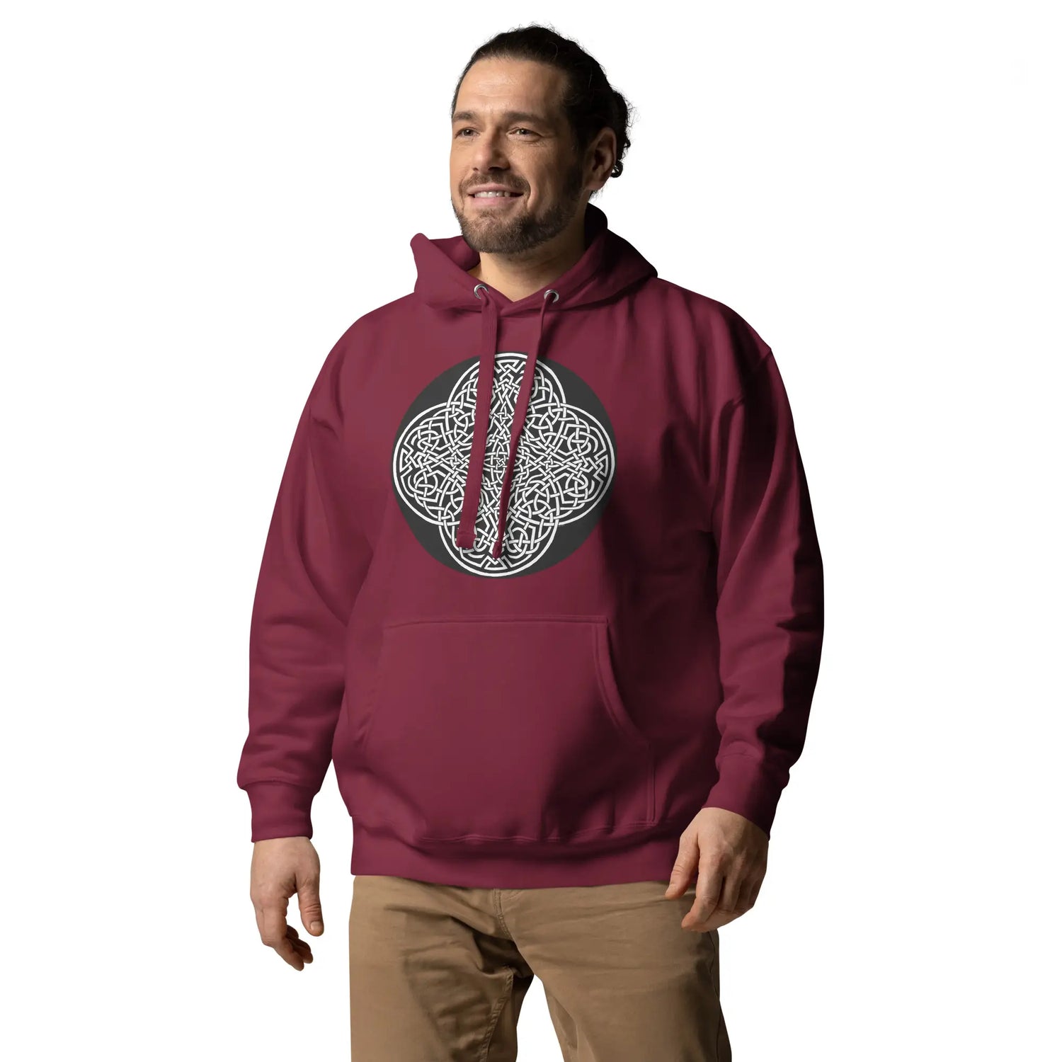 A young man wearing a maroon Xigfireon graphic hoodie featuring the Black & White Circle iteration of the `Reach Of The Spirit` Celtic knot design. The `Reach Of The Spirit` Celtic knot represents our magnificent Mother Earth.