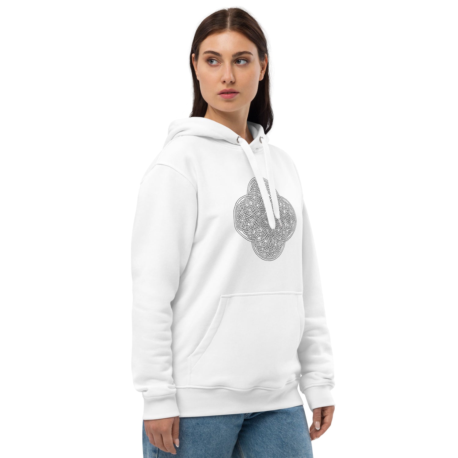 A young woman wearing a white Xigfireon graphic eco hoodie featuring the Black & White Hollow iteration of the `Reach Of The Spirit` Celtic knot design. The `Reach Of The Spirit` Celtic knot is an Earth symbol.