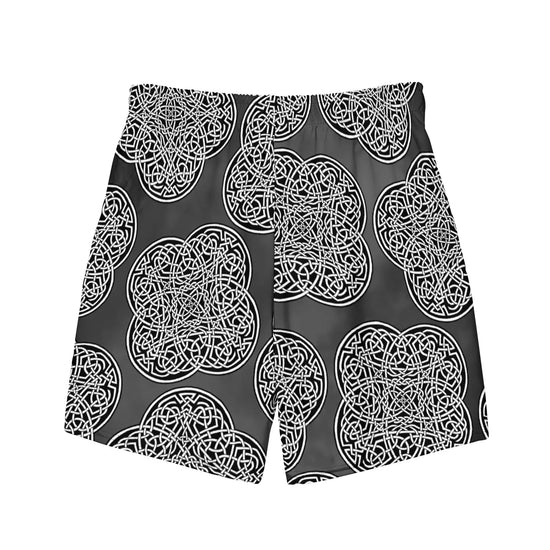 The back side of a pair of Xigfireon graphic swim trunks featuring the Black & White Solid Forest patterned series of the `Reach Of The Spirit` Celtic knot design.