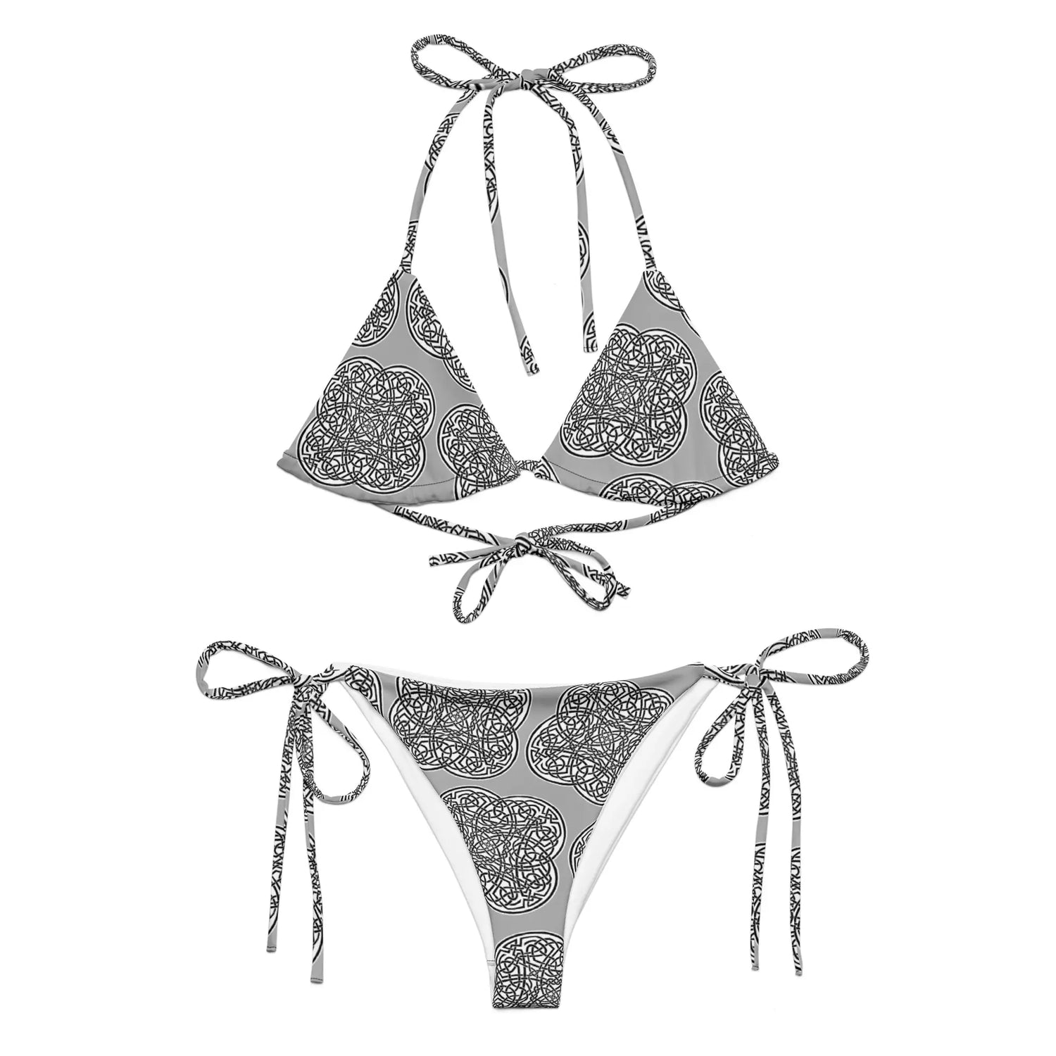 A view of the outside of a string bikini featuring the Inverted Black & White Solid iteration of the `Reach Of The Spirit` Celtic knot pattern.