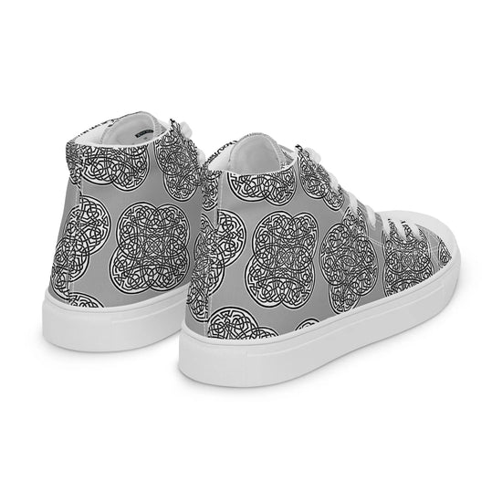 A view of the back of a pair of Xigfireon canvas high tops featuring the Inverted Black & White Solid iteration of the `Reach of The Spirit` Celtic knot pattern.