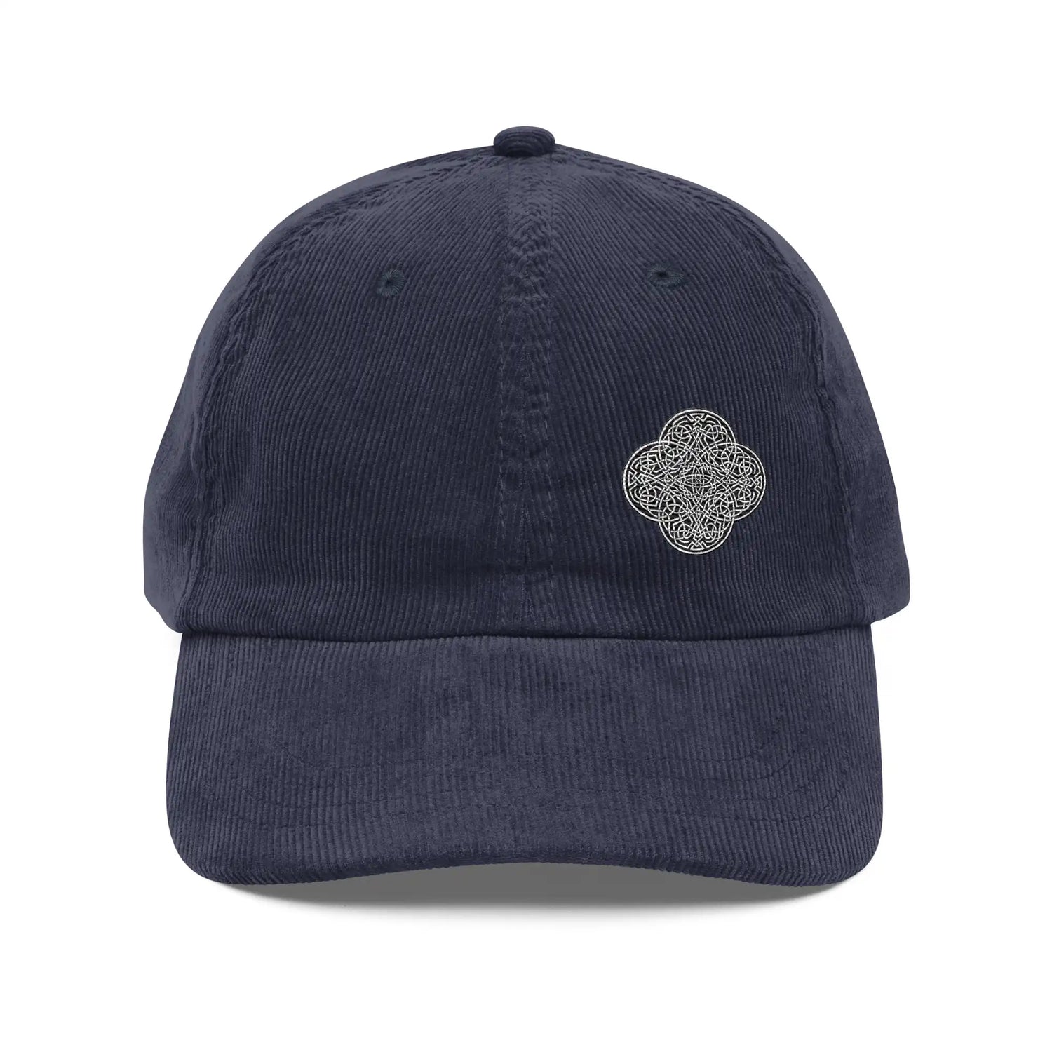 The front side of a navy blue Xigfireon vintage corduroy cap embroidered with the Black & White Solid iteration of the `Reach Of The Spirit` Celtic knot design offset to the left.