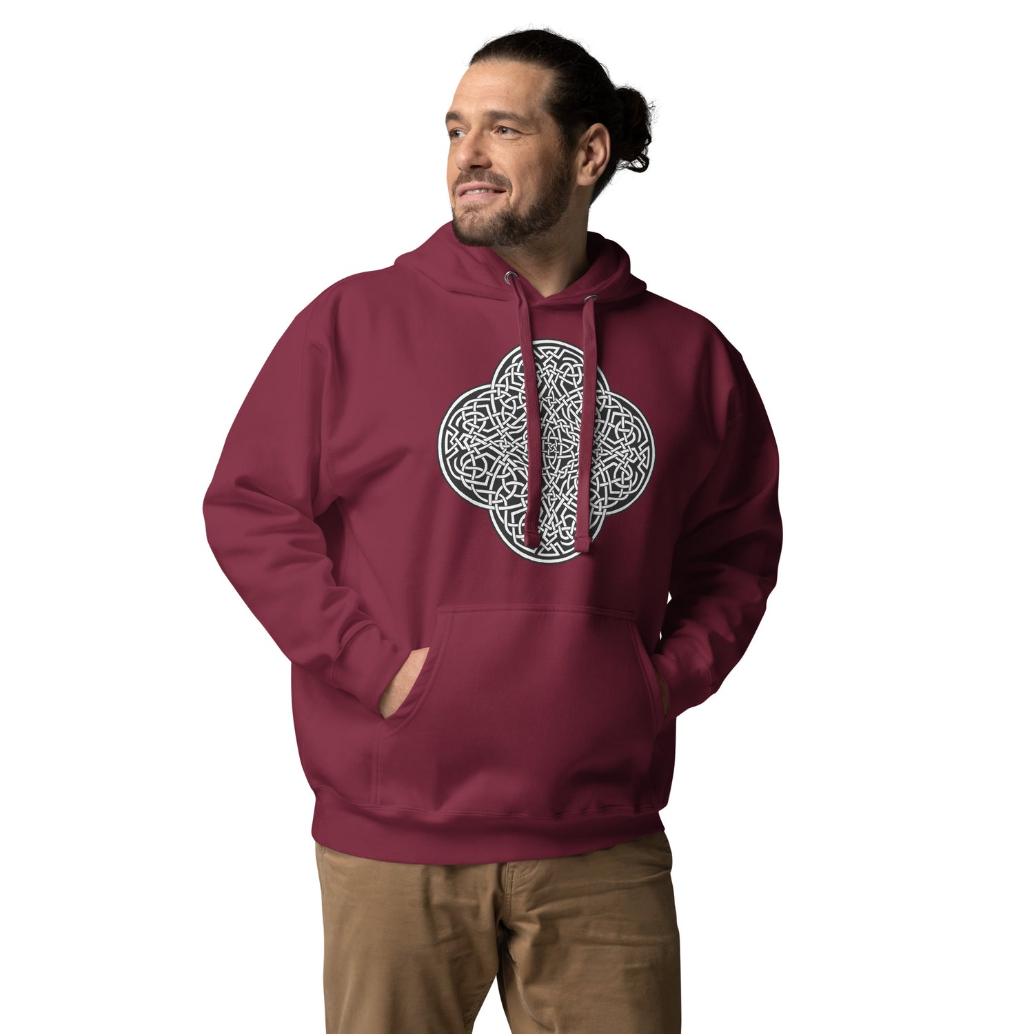 A young man wearing a maroon Xigfireon graphic hoodie featuring the Black & White Solid iteration of the `Reach Of The Spirit` Celtic knot design. The `Reach Of The Spirit` Celtic knot symbolizes the Earth.