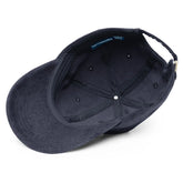A view of the inside of a navy blue Xigfireon vintage corduroy cap.