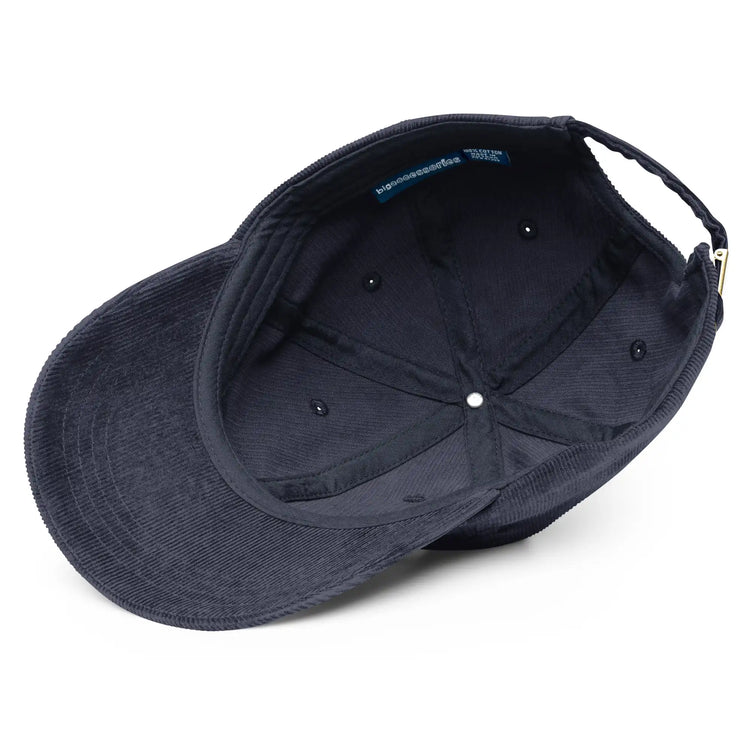 A view of the inside of a navy blue Xigfireon vintage corduroy cap.