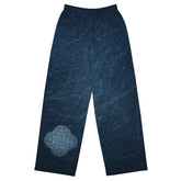 The front side of a pair of Xigfireon graphic wide leg pants featuring the Blue Slate iteration of the `Reach Of The Spirit` Celtic knot design.
