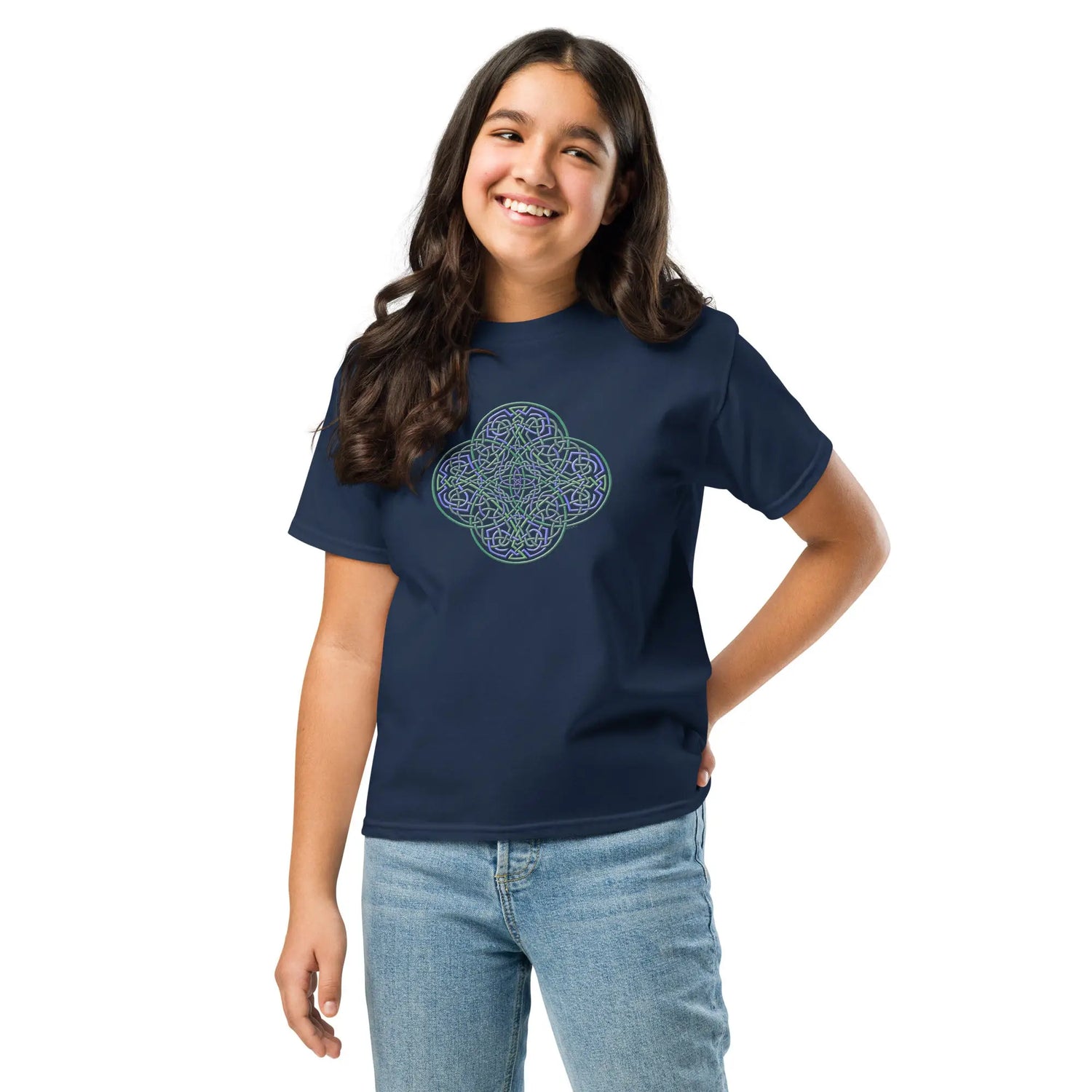 A girl wearing a navy blue Xigfireon kids graphic t-shirt featuring the Living Colour iteration of the `Reach Of The Spirit` Celtic knot design. The `Reach Of The Spirit` Celtic knot symbolizes Mother Earth.