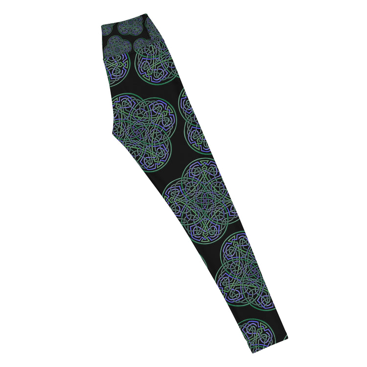 The right side of a pair of Xigfireon graphic yoga leggings featuring the Living Colour Black patterned series of the `Reach Of The Spirit` Celtic knot design.