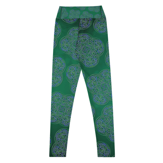 The back side of a folded pair of Xigfireon graphic yoga leggings featuring the Living Colour Forest patterned series of the `Reach Of The Spirit` Celtic knot design.