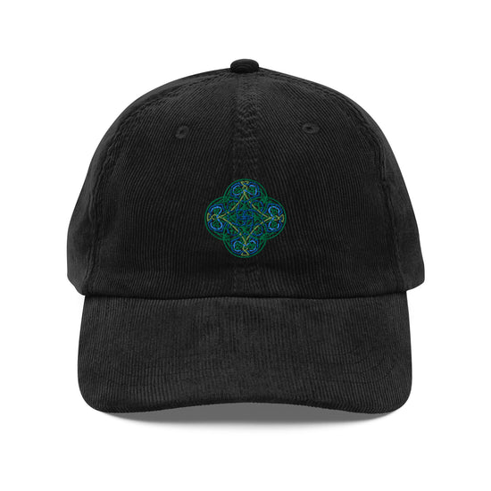 The front side of a black Xigfireon vintage corduroy cap embroidered with the Living Colour iteration of the `Reach Of The Spirit` Celtic knot design.