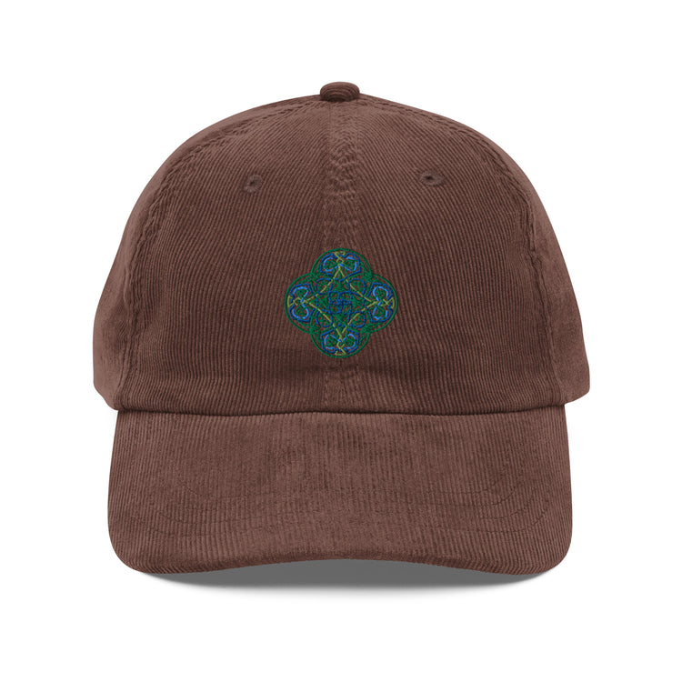 The front side of a brown Xigfireon vintage corduroy cap embroidered with the Living Colour iteration of the `Reach Of The Spirit` Celtic knot design.