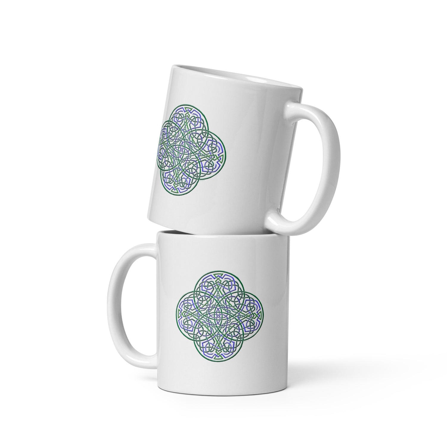 A stack of two Xigfireon white ceramic 11oz mugs featuring the Living Colour iteration of the `Reach Of The Spirit` Celtic knot design. This Celtic knot symbolizes Mother Earth.