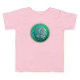 A pink Xigfireon toddler graphic t-shirt featuring the Deep Forest iteration of the `Reach Of The Spirit` Celtic knot design. The `Reach Of The Spirit` Celtic knot symbolizes Mother Earth.