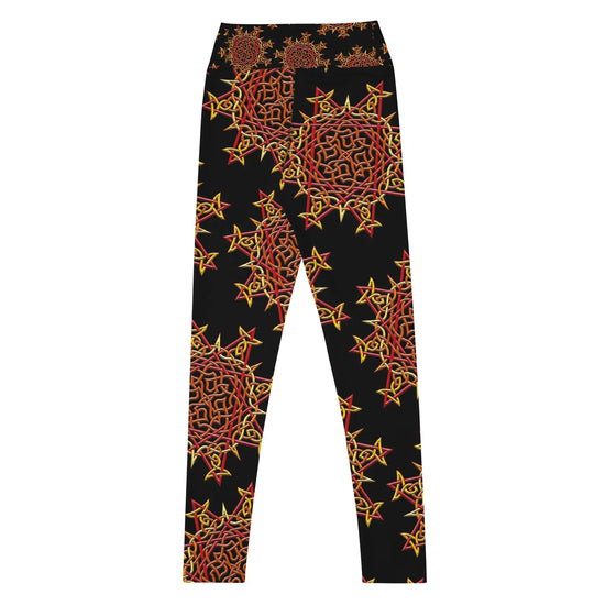 The back side of a pair of Xigfireon graphic yoga leggings featuring the Fire Colour Black patterned series of the Morning Star Fire Celtic knot design.