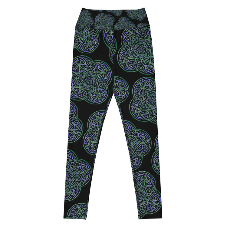 The front side of a pair of Xigfireon graphic yoga leggings featuring the Living Colour Black patterned series of the Reach Of The Spirit Celtic knot design.