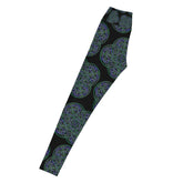 The left side of a pair of Xigfireon graphic yoga leggings featuring the Living Colour Black patterned series of the Reach Of The Spirit Celtic knot design.