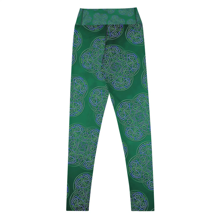 The back side of a folded pair of Xigfireon graphic yoga leggings featuring the Living Colour Forest patterned series of the Reach Of The Spirit Celtic knot design.