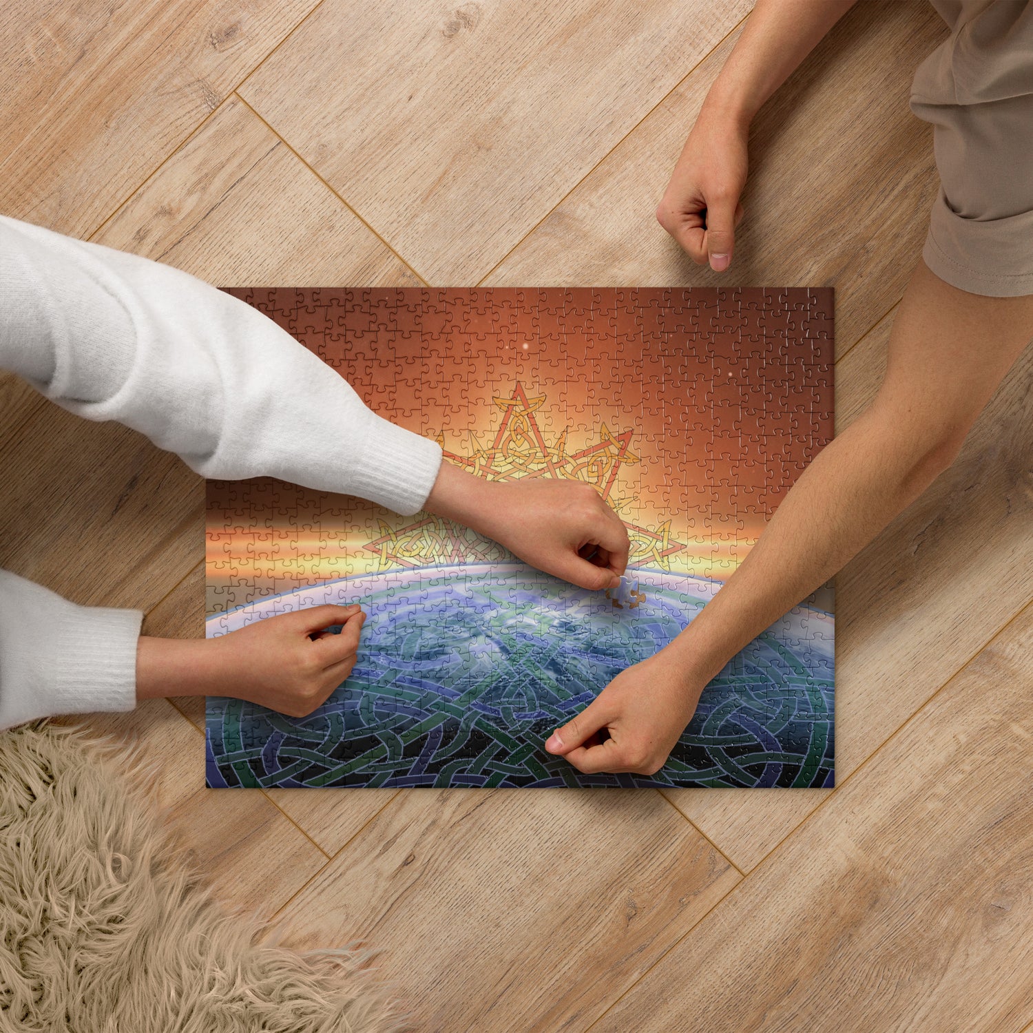 A couple of kids working on a 520 piece jigsaw puzzle featuring the `Derivation II` Celtic knot merger design, which symbolizes the Sun and the Earth and their cosmic dance.