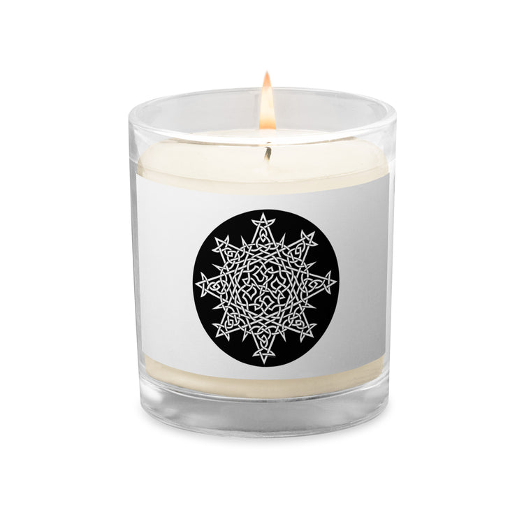 A Xigfireon glass jar soy wax candle featuring the Black & White Circle iteration of the `Morning Star Fire` Celtic knot design. The `Morning Star Fire` Celtic knot symbolizes Father Sun.